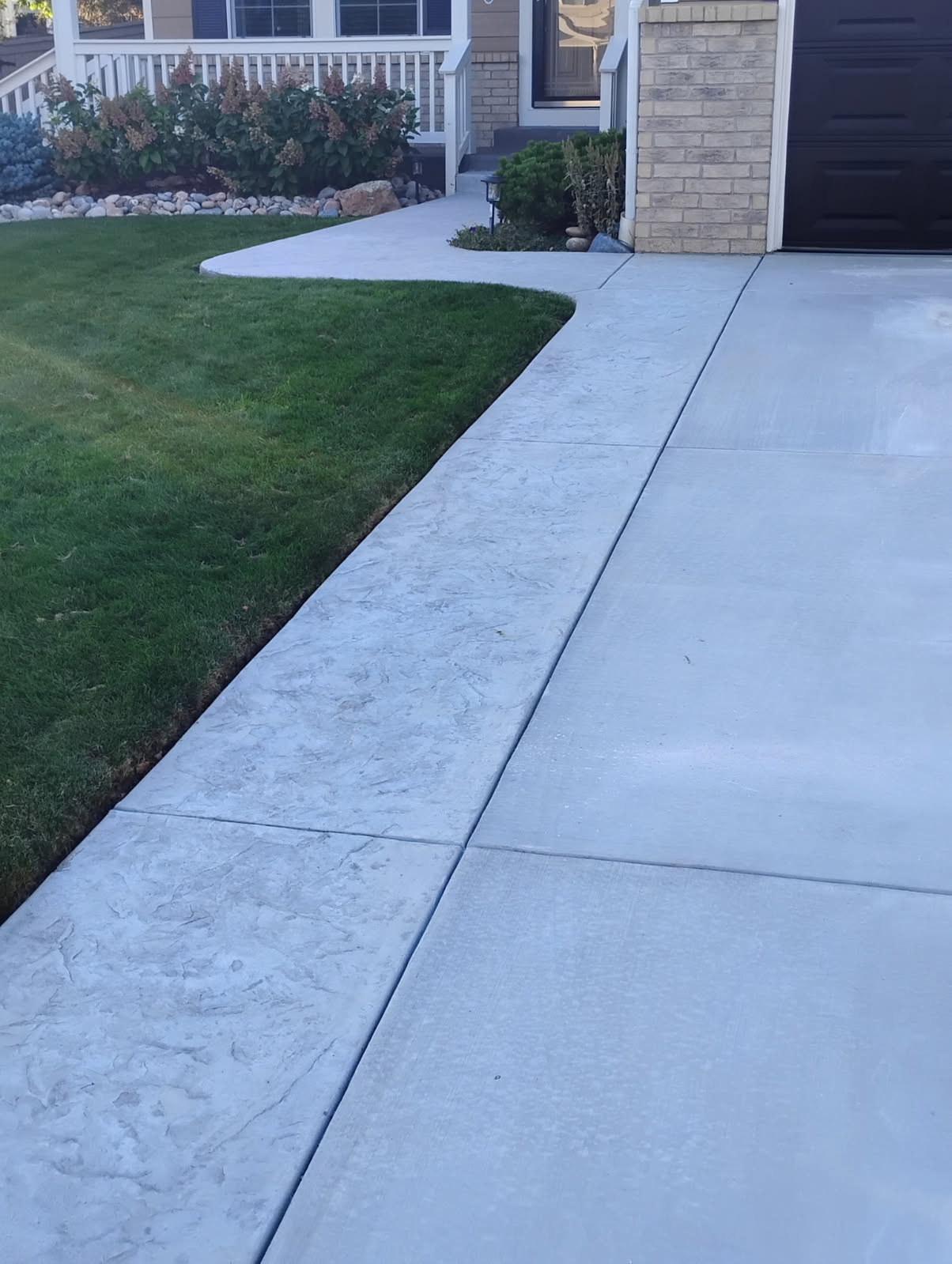 Driveway with Textured Border by Leal Contracting LLC Concrete